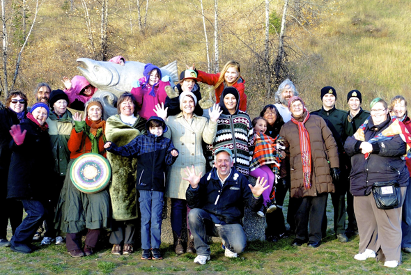 Group photo from the Honour Ceremony for Rivers, Salmon, and People in McMillan Creek Fishing Park in Prince George where four prayer pots were buried. Photo: Helen Styles