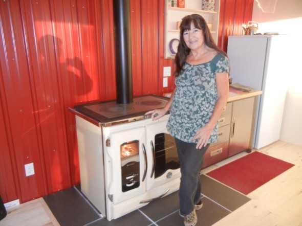 Sandy loves her new wood cookstove. Photo: Paul Hearsey   